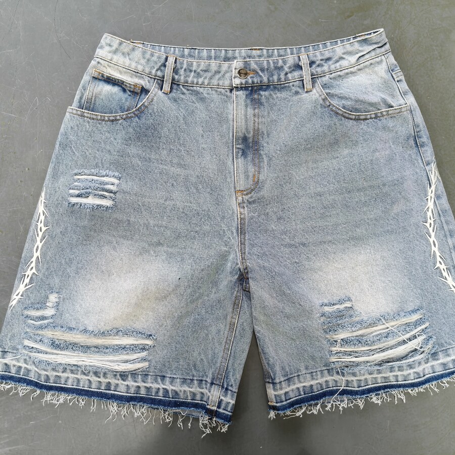 Washed denim pants with vintage distress effect