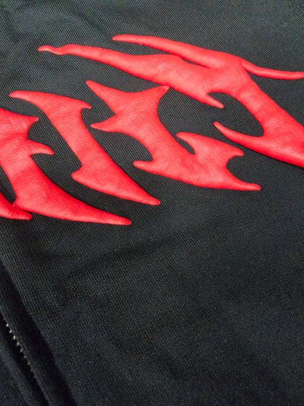Actual raised red artwork detail on black fabric