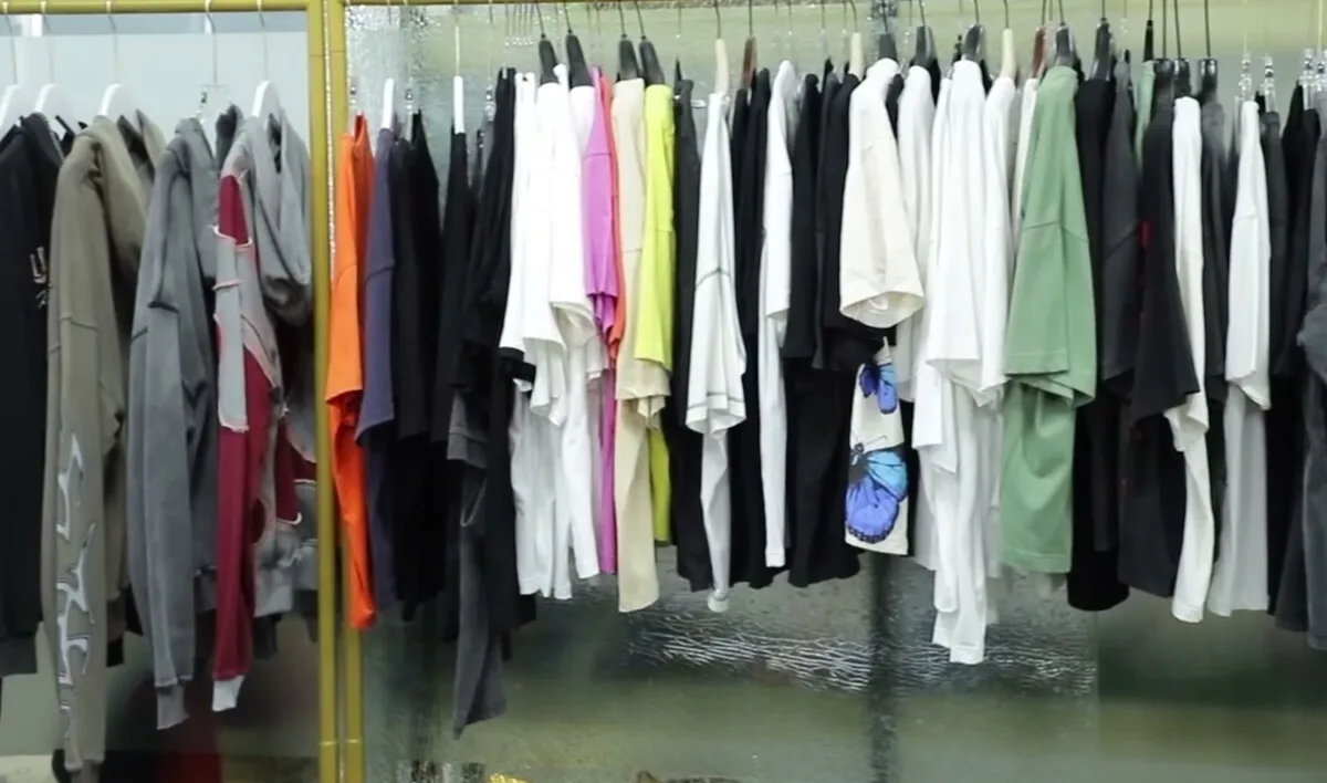Rack of finished sample garments across several styles