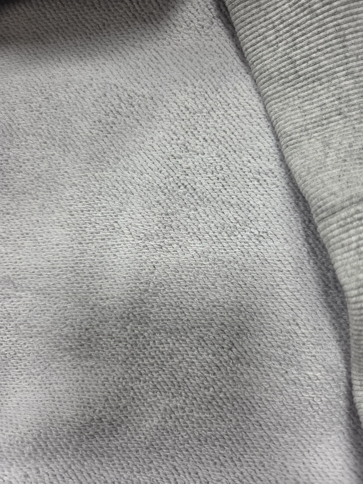 Close-up of the exposed loops inside a grey French terry sample
