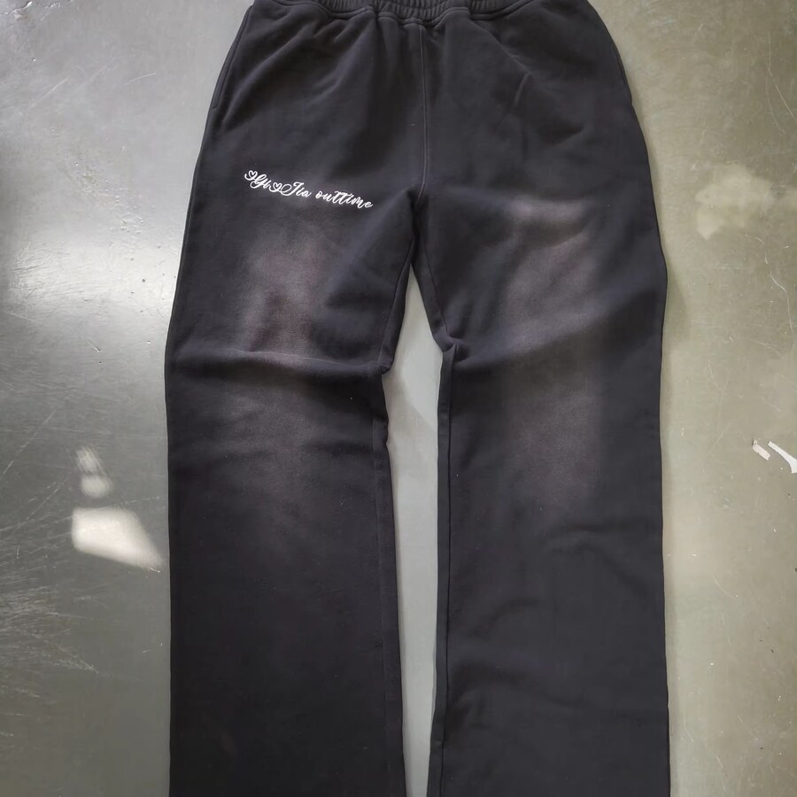 Black streetwear pants sample on factory floor