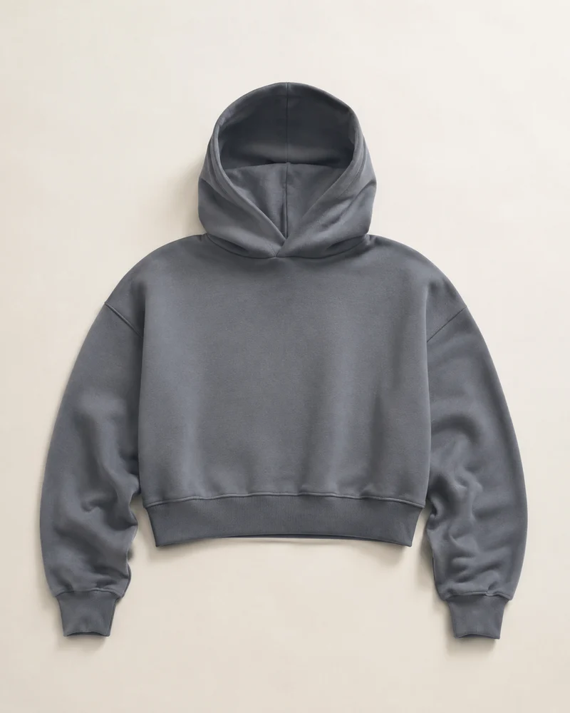 Slate-grey cropped hoodie design illustration with a shorter body and roomy sleeves