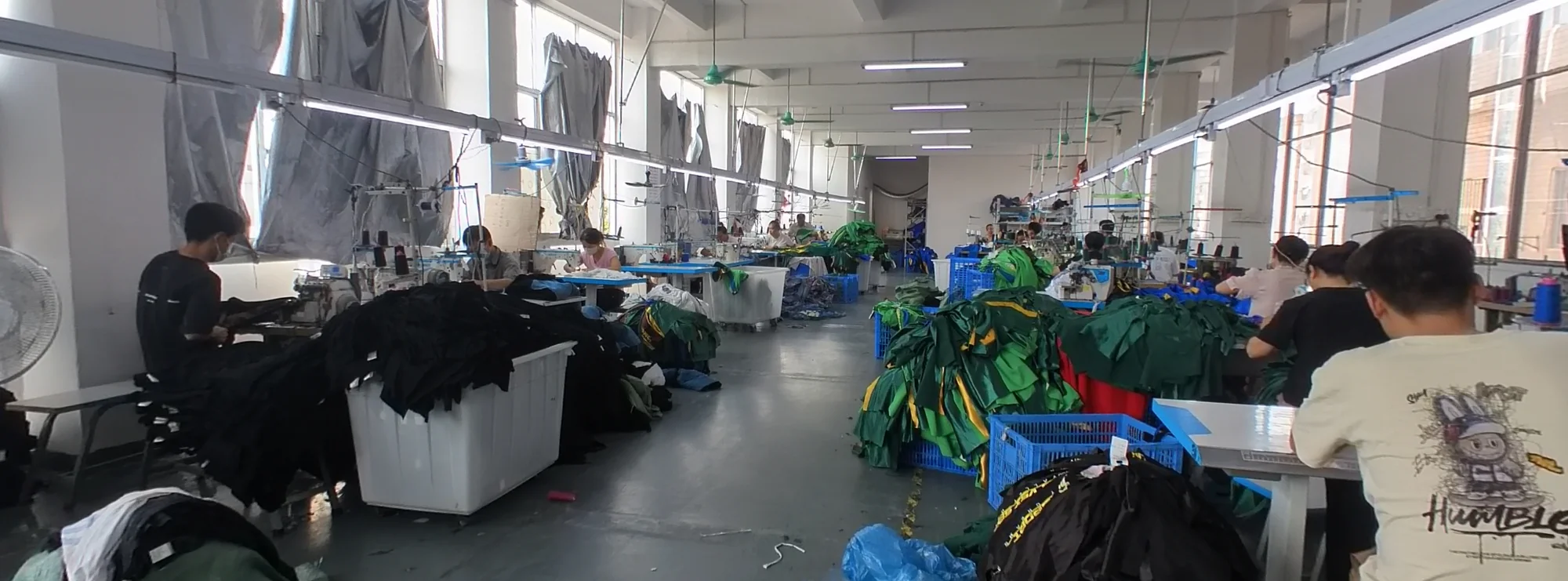 Jiashun sewing team working at production tables on the factory floor